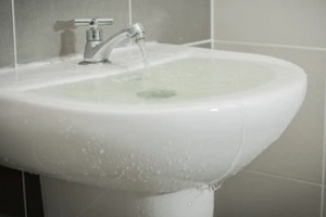 bathroom sink overflowing