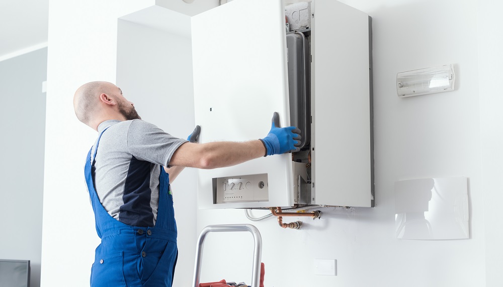 engineer doing a boiler inspection at home