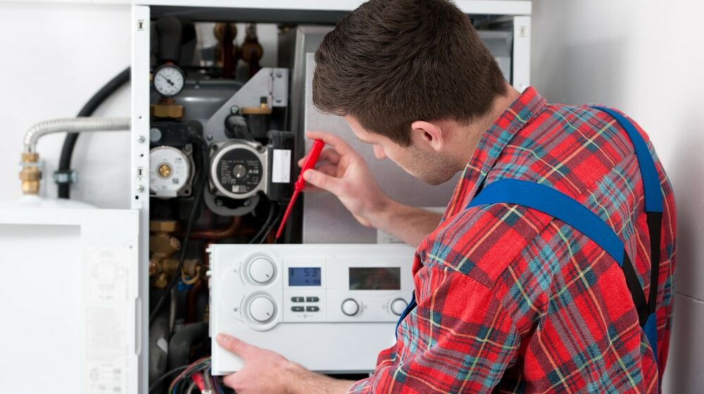 man testing pcv plate of boiler