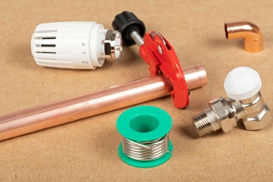 objects of home heating system brass valve, thermostatic valve, pipe cutter, copper plumbing parts