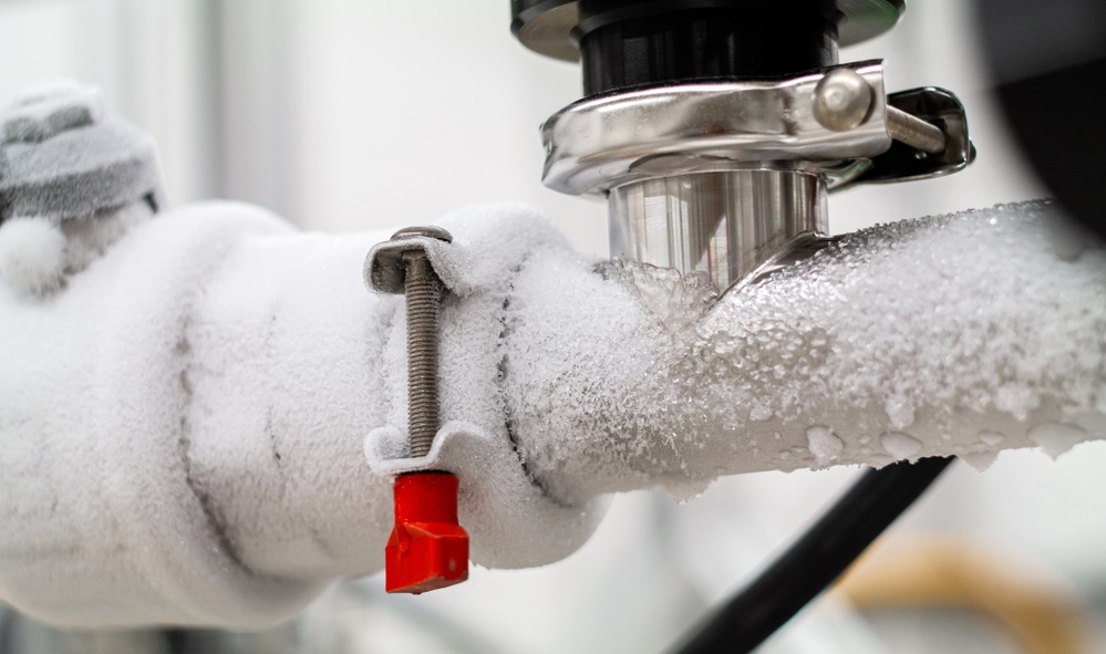 pipes with a valve and black plastic lever close up in a science laboratory