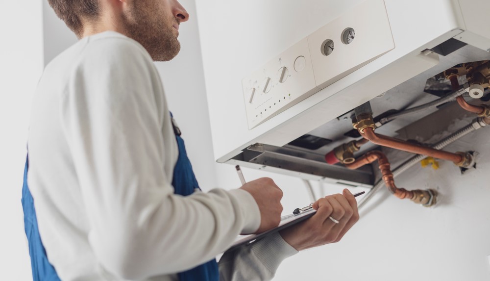 technical person inspecting boiler