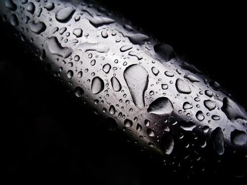 water drops on a metal pipe